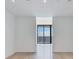 Bright living area with hardwood floors and sliding glass doors offering water views at 2912 W Santiago St # 2204, Tampa, FL 33629