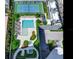 Resort-style pool and tennis court with lounge chairs and landscaping at 2912 W Santiago St # 2204, Tampa, FL 33629