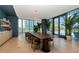 Elegant dining area with a long table, leather chairs, and large windows at 2912 W Santiago St # 2204, Tampa, FL 33629