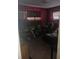 Small bedroom with window and dark-red walls at 321 77Th Ave, St Pete Beach, FL 33706