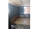 Spacious living room with large windows and wood paneling at 321 77Th Ave, St Pete Beach, FL 33706