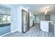 Kitchen with stainless steel refrigerator and gray vinyl flooring at 4010 Leonard St, Valrico, FL 33594