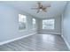 Spacious bedroom with gray flooring and ceiling fan at 4010 Leonard St, Valrico, FL 33594