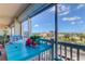 Private balcony with blue table and chairs, offering city views at 500 Treasure Island Cswy # 606, Treasure Island, FL 33706