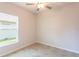 Well-lit bedroom with ceiling fan and window at 540 Rose Apple Cir, Port Charlotte, FL 33954