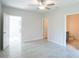 Bright bedroom with ceiling fan and access to a private bathroom at 540 Rose Apple Cir, Port Charlotte, FL 33954