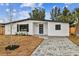 Beautifully renovated home featuring modern design and a landscaped front yard at 5908 S Manhattan Ave, Tampa, FL 33616