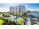 Resort-style pool and marina with lush landscaping and boat slips at 660 Island Way # 908, Clearwater Beach, FL 33767