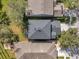 House and backyard aerial view, dark gray roof at 7753 Foxgrove Dr, Land O Lakes, FL 34637