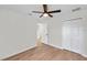 Bedroom with ceiling fan and door to hallway at 7753 Foxgrove Dr, Land O Lakes, FL 34637