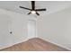 Bedroom with ceiling fan and double doors at 7753 Foxgrove Dr, Land O Lakes, FL 34637