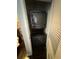 Compact laundry closet with stackable washer and dryer at 777 N Ashley Dr # 1808, Tampa, FL 33602
