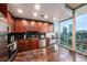 Modern kitchen with dark wood cabinets, stainless steel appliances, and city views at 777 N Ashley Dr # 1808, Tampa, FL 33602