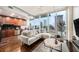 Open concept living area with modern furniture and city views at 777 N Ashley Dr # 1808, Tampa, FL 33602