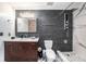 Modern bathroom with a large walk-in shower and dark gray tile at 777 N Ashley Dr # 1808, Tampa, FL 33602