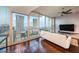 Living room features city views, balcony access, and comfortable seating at 777 N Ashley Dr # 1808, Tampa, FL 33602