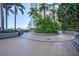 Landscaped walkway with tropical plants and seating at 777 N Ashley Dr # 1808, Tampa, FL 33602