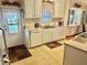 Bright eat-in kitchen, featuring white cabinets, and a double sink at 9790 66Th N St # 289, Pinellas Park, FL 33782