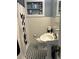 Charming bathroom featuring a pedestal sink, black and white tiled floor, and a shower with a decorative curtain at 1003 W Mahoney St, Plant City, FL 33563