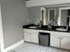 Bathroom featuring double sinks, and a large mirror at 1003 W Mahoney St, Plant City, FL 33563
