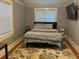Comfortable bedroom with natural light, neutral decor, and hardwood floors at 1003 W Mahoney St, Plant City, FL 33563