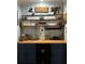Custom built-in bar featuring blue cabinets, and a wooden counter at 1003 W Mahoney St, Plant City, FL 33563