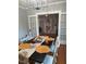 Elegant dining room with hardwood floors, modern light fixture, and direct view into the reading room at 1003 W Mahoney St, Plant City, FL 33563