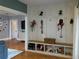 Entryway with a built-in bench, hooks, and decorative wall paneling at 1003 W Mahoney St, Plant City, FL 33563