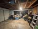 Unfinished garage space providing ample storage and workspace with a roll-up garage door at 1003 W Mahoney St, Plant City, FL 33563