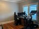 Bright home office featuring desk with computer monitors, an ergonomic chair, and exercise bike for a productive workspace at 1003 W Mahoney St, Plant City, FL 33563
