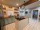 Bright kitchen featuring butcher block countertops, stainless steel appliances, and a central island at 1003 W Mahoney St, Plant City, FL 33563