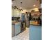 Traditional kitchen with stainless steel appliances, butcher block countertops, and ample cabinet space at 1003 W Mahoney St, Plant City, FL 33563