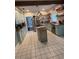 Spacious kitchen featuring butcher block countertops, white tile floors, and stainless steel appliances at 1003 W Mahoney St, Plant City, FL 33563
