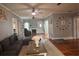 Inviting living room boasts hardwood floors, a fireplace, sectional sofa, and neutral decor at 1003 W Mahoney St, Plant City, FL 33563