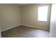 Simple bedroom with wood-look flooring and large window at 107 Slipper Key Rd, Apollo Beach, FL 33572