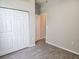 Well-lit bedroom featuring wood-look flooring and large closet at 107 Slipper Key Rd, Apollo Beach, FL 33572