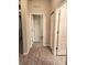 Clean hallway with wood-look flooring and access to bedrooms at 107 Slipper Key Rd, Apollo Beach, FL 33572