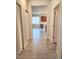 Hallway view of kitchen and bedrooms at 107 Slipper Key Rd, Apollo Beach, FL 33572