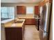 Modern kitchen with stainless steel appliances and light wood cabinets at 107 Slipper Key Rd, Apollo Beach, FL 33572