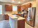 Modern kitchen with stainless steel appliances and ample cabinetry at 107 Slipper Key Rd, Apollo Beach, FL 33572