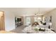 Open living room with a neutral color palette and access to the backyard at 107 Slipper Key Rd, Apollo Beach, FL 33572