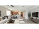 Open living area with kitchen and breakfast bar at 107 Slipper Key Rd, Apollo Beach, FL 33572