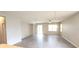 Open living room with wood-look tile floors and neutral walls at 107 Slipper Key Rd, Apollo Beach, FL 33572