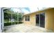 Screened patio with sliding door access to home and backyard view at 107 Slipper Key Rd, Apollo Beach, FL 33572