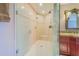Large walk-in shower with glass enclosure and built-in seat at 1135 Candler Rd, Clearwater, FL 33765