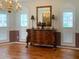 Formal dining room with hardwood floors, buffet, and chandelier at 1135 Candler Rd, Clearwater, FL 33765