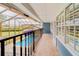 Balcony with a view of the screened-in pool and backyard at 1135 Candler Rd, Clearwater, FL 33765