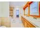 Bright bathroom with double vanity, tiled shower, and natural light at 1135 Candler Rd, Clearwater, FL 33765