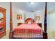 Close-up of four-poster bed, dresser, and armoire in second bedroom at 1135 Candler Rd, Clearwater, FL 33765