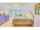 Charming bedroom with light purple walls, white furniture, and bay windows at 1135 Candler Rd, Clearwater, FL 33765